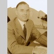 Man posing at his desk (ddr-njpa-2-926)