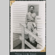 Man on stairs with clipboard (ddr-densho-434-259)