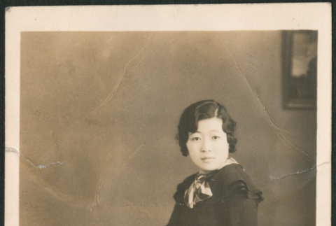 Portrait of woman on bench (ddr-densho-316-218)