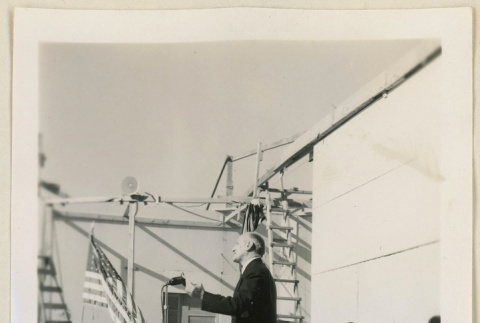 Dr. Jones stands at a microphone (ddr-densho-37-961)