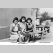 Three young women sitting outside barracks (ddr-ajah-6-443)