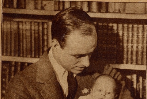 A man holding a baby (ddr-njpa-1-1665)