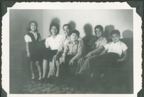A family sitting on a couch (ddr-densho-328-376)