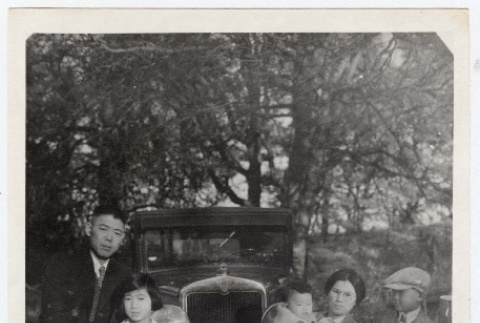 Family in front of car (ddr-densho-259-681)