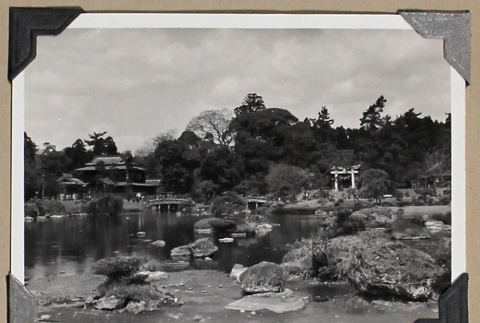 View of a pond and torii gate in a Japanese garden (ddr-densho-404-276)