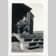 Soldier kneeling on stairs (ddr-densho-22-368)