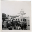 Group waiting at airport, PanAm airplane in background (ddr-densho-426-866)