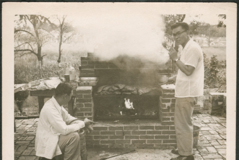 Two men grilling (ddr-densho-293-134)