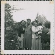 Three women pose informally  with a baby (ddr-densho-321-270)