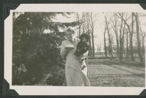 woman holding baby and dessert (ddr-densho-378-522)