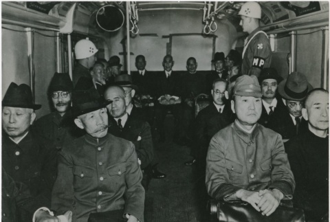Prisoners being transferred from prison to the trials by bus (ddr-densho-299-158)