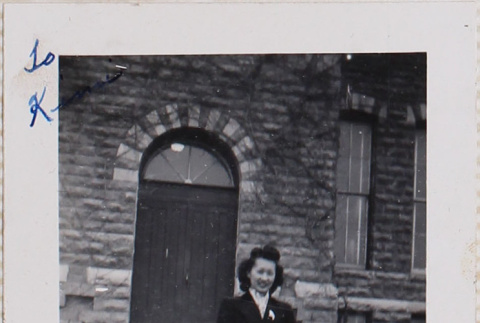 Woman standing on steps outside building (ddr-densho-464-118)
