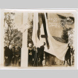 Group outside Japanese Pavilion lowering flag (ddr-densho-426-2095)