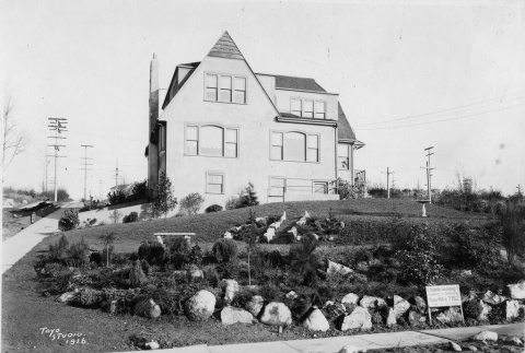 House with a F. Kubota Gardening Company sign in the front yard (ddr-densho-354-134)