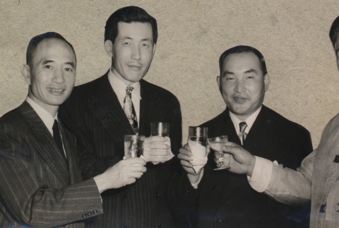 Japanese Consulate official, Taisaku Kojima, and other men raising a toast (ddr-njpa-4-492)