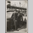 Man and woman standing by car (ddr-densho-466-112)