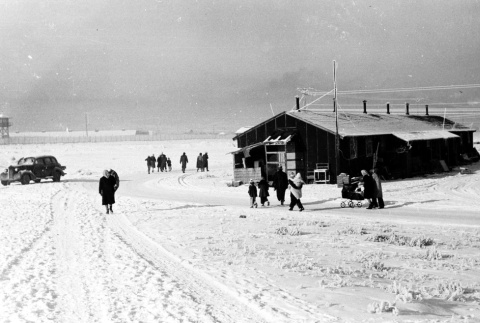 Japanese Americans walking in the snow (ddr-densho-37-240)