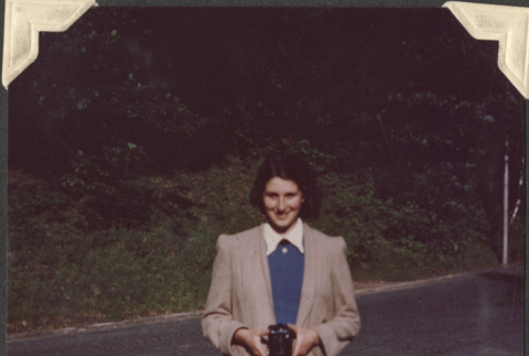 Color photo of women holding camera (ddr-densho-466-836)