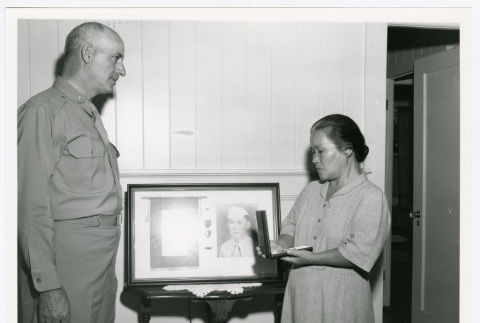 Woman receiving medal (ddr-densho-1007-312)