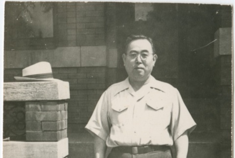 Suejiro Kosai standing on steps (ddr-densho-349-24)