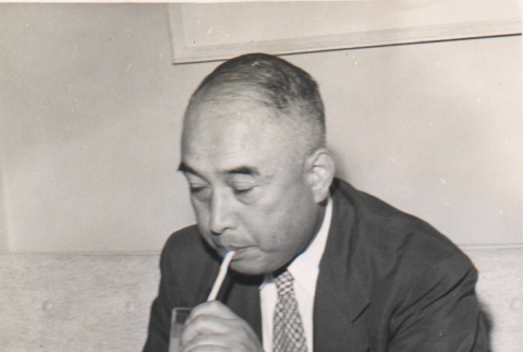 Tadao Kuraishi with a drink (ddr-njpa-4-335)