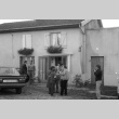 Loni Ding and group outside house (ddr-densho-1007-564)