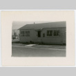 Photograph of Manzanar staff housing with dog in front (ddr-csujad-47-350)