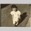 Masako Takahashi kneeling on sidewalk (ddr-densho-426-216)