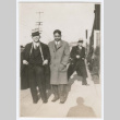 Three men on sidewalk (ddr-densho-383-395)