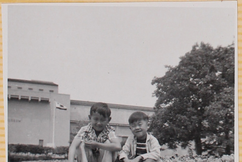 Two boys sitting on lawn (ddr-densho-522-261)