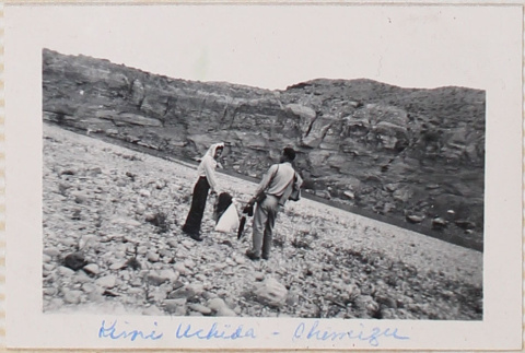 Man and woman standing in rocky field (ddr-densho-464-27)