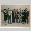 Group of 10 people at Minidoka, including the Sakura family (ddr-densho-523-137)