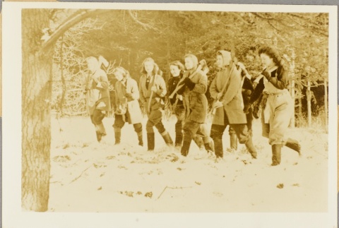 Women carrying axes through a wooded area (ddr-njpa-13-219)