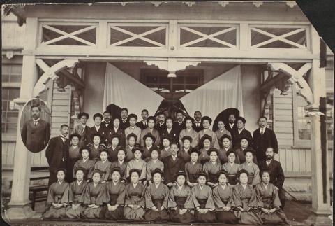 Group photograph of Japanese men and women with Hinomaru (ddr-densho-259-178)