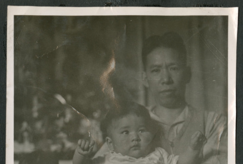 Photo of a man with two children (ddr-densho-483-750)