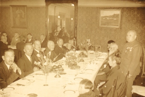 People gathered at a dinner party (ddr-njpa-4-2639)
