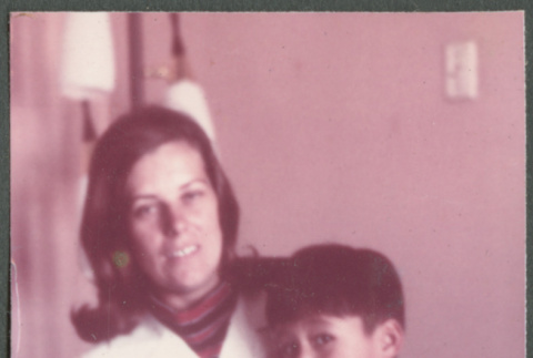 Woman holding boy in her lap (ddr-densho-523-472)