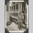 Man standing next to train car (ddr-densho-466-671)