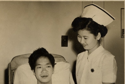 Surgery patient with a nurse at Kuakini Hospital (ddr-njpa-2-637)