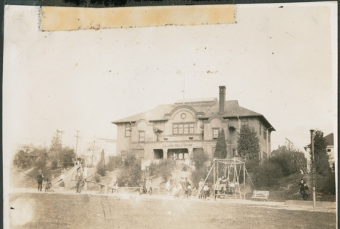 Collins Field House with children playing in front (ddr-densho-483-524)