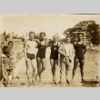Four swimmers posing with their coach at a pool (ddr-njpa-2-506)
