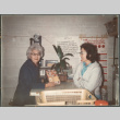 Two women at counter (ddr-densho-523-625)