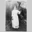Issei woman in front of a house (ddr-densho-154-6)