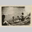 Three men in a boat, two in the water (ddr-densho-466-383)