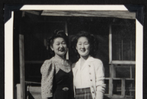 Two women outside a barrack (ddr-densho-542-704)