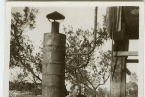 Man at water pump (ddr-densho-201-157)