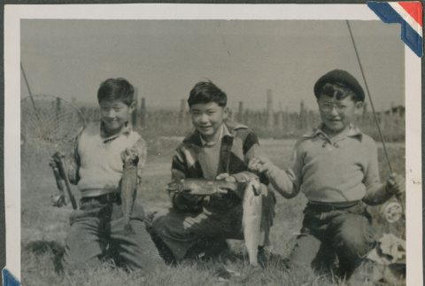 Three boys with their catch of fish (ddr-densho-201-953)