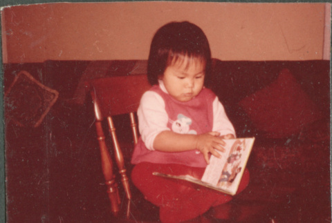 Girl with book (ddr-densho-523-507)
