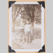 Photo of two boys with a bicycle (ddr-densho-483-445)