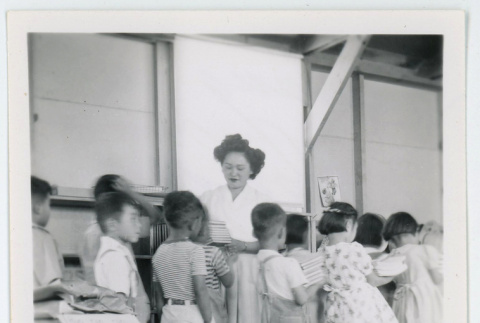 Students turning in their books (ddr-densho-37-2136)